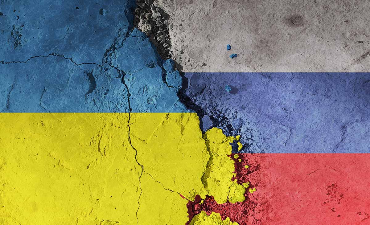 Broken concrete slabs bearing Ukraine and Russia colours.
