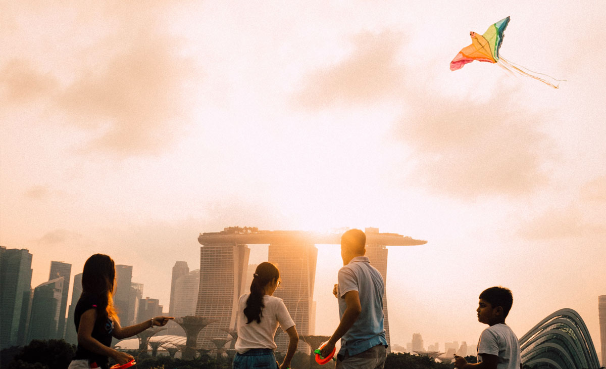 A view of people flying kites on the Marina Barrage