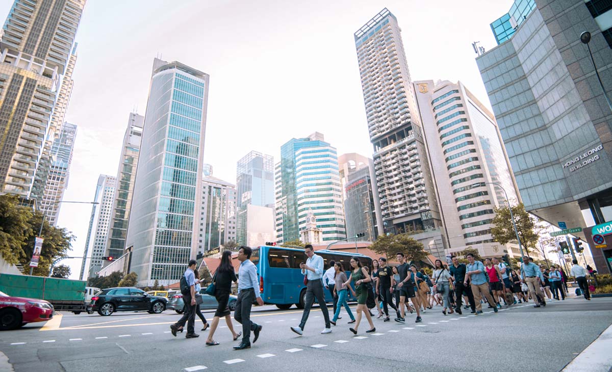 Crowded pedestrian crossing in busy city of Singapore